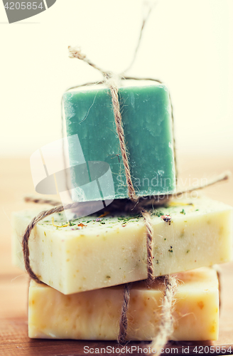 Image of close up of handmade soap bars on wood