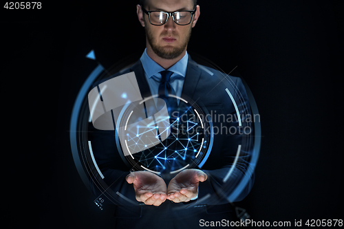 Image of businessman with virtual projection over black