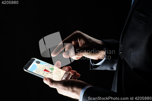 Image of close up of businessman with gps map on smartphone