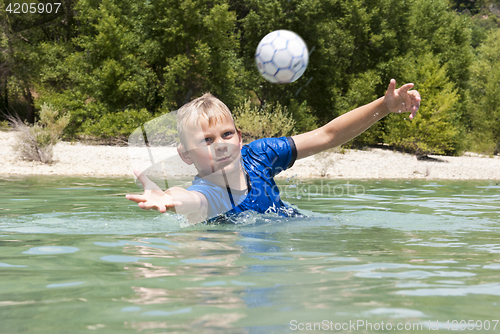 Image of Diving for a ball in a lake