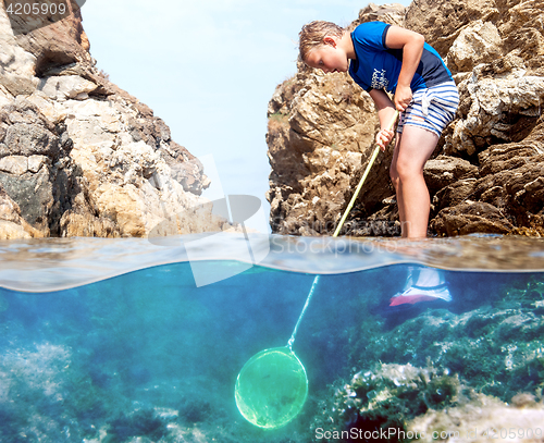 Image of Boy with fishing net