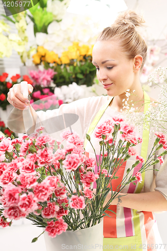 Image of A bouquet of cut flowers course of floristic. Laying flowers. Beautiful cut flowers, florist arranges medley