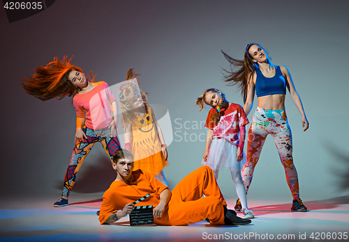 Image of Group of man, woman and teens dancing hip hop choreography