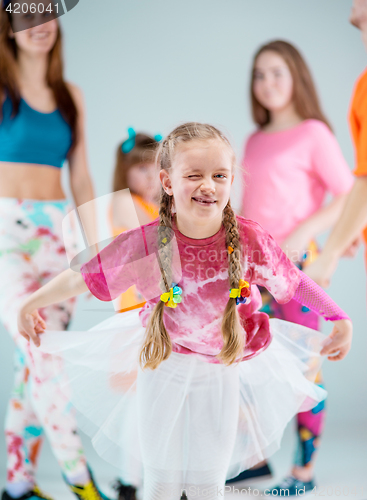 Image of Group of man, woman and teens dancing hip hop choreography