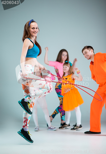 Image of Group of man, woman and teens dancing hip hop choreography