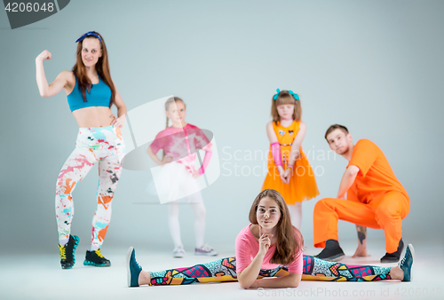 Image of Group of man, woman and teens dancing hip hop choreography