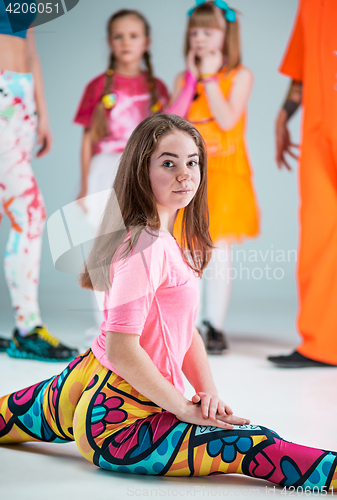 Image of Group of man, woman and teens dancing hip hop choreography