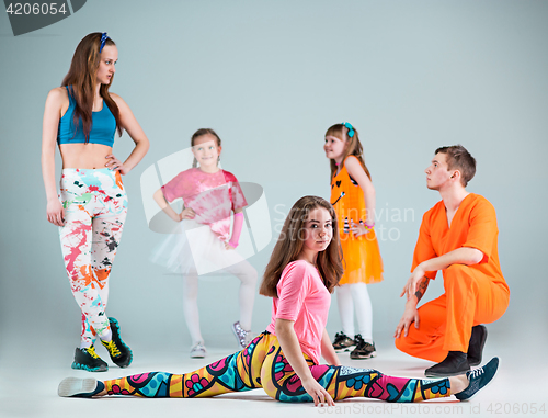 Image of Group of man, woman and teens dancing hip hop choreography