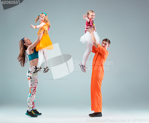 Image of Group of man, woman and teens dancing hip hop choreography