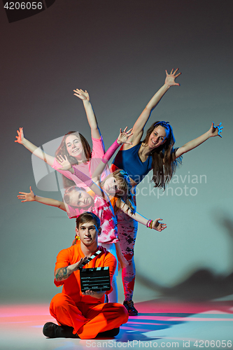 Image of Group of man, woman and teens dancing hip hop choreography