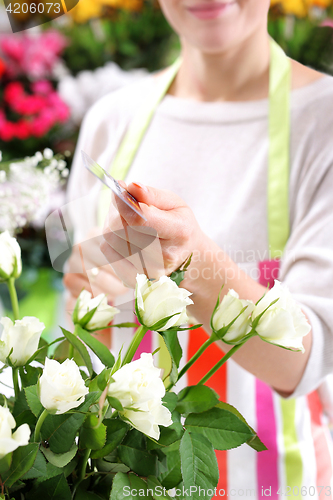 Image of Flower containers laid a bouquet of cut flowersBeautiful cut flowers, florist arranges medley