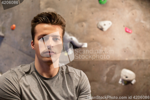 Image of young man exercising at indoor climbing gym