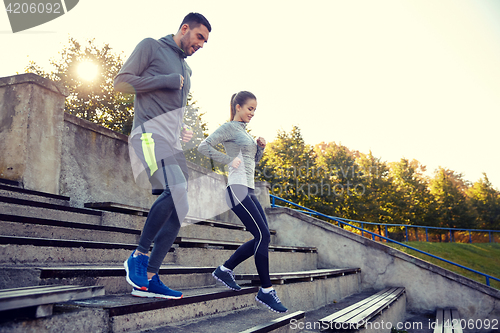 Image of couple running downstairs on stadium