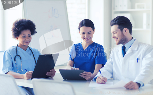 Image of group of happy doctors meeting at hospital office