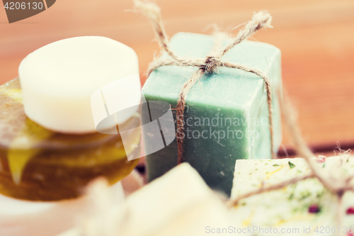 Image of close up of handmade soap bars on wood