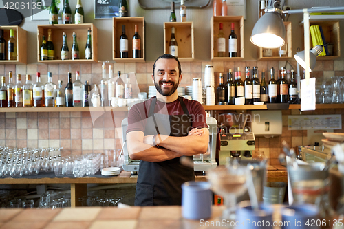 Image of happy man, barman or waiter at bar