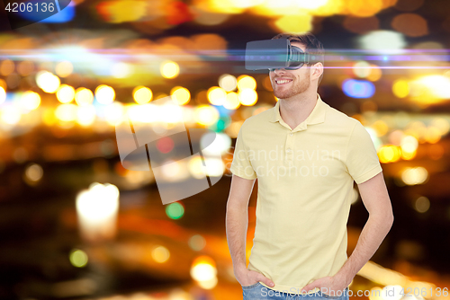 Image of happy man in virtual reality headset or 3d glasses