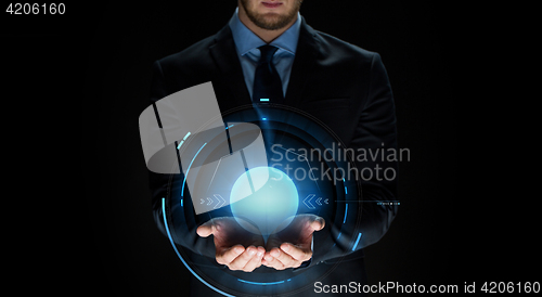Image of close up of businessman with virtual projection