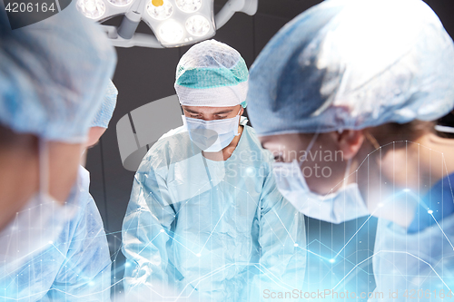 Image of group of surgeons in operating room at hospital