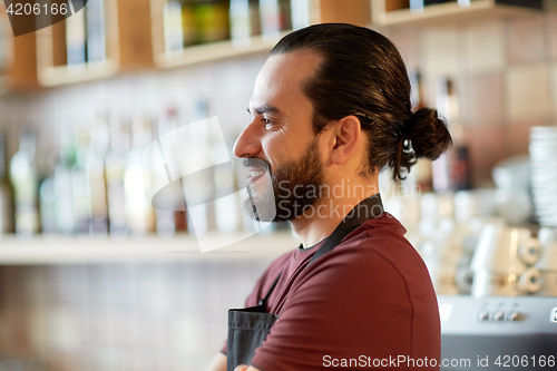 Image of happy man, barman or waiter at bar