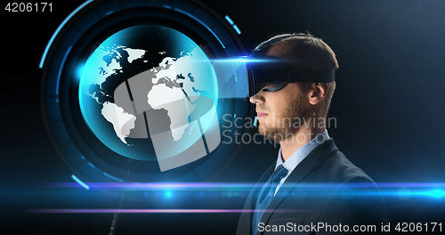 Image of businessman in virtual reality glasses or headset
