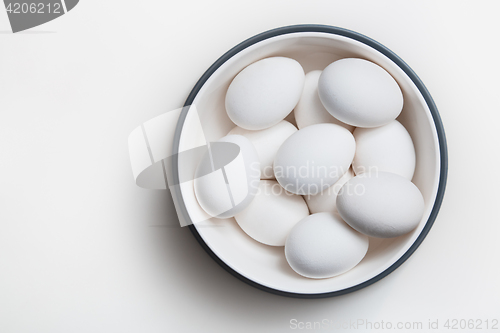 Image of Hen eggs in a white bowl