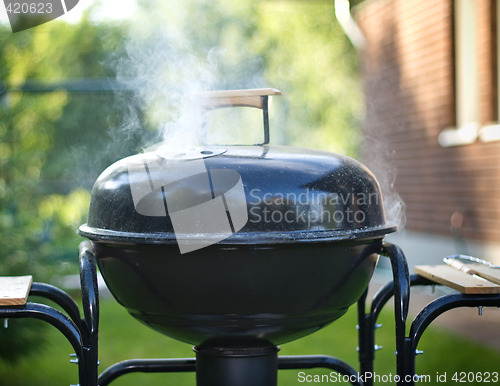 Image of cooking in a barbeque