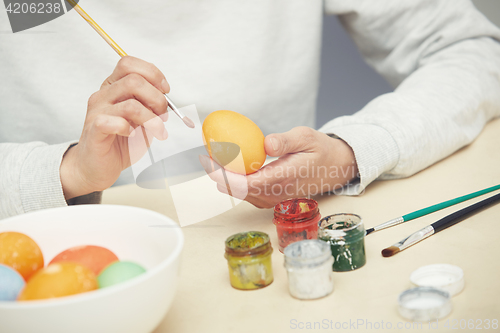 Image of Woman preparing Easter eggs