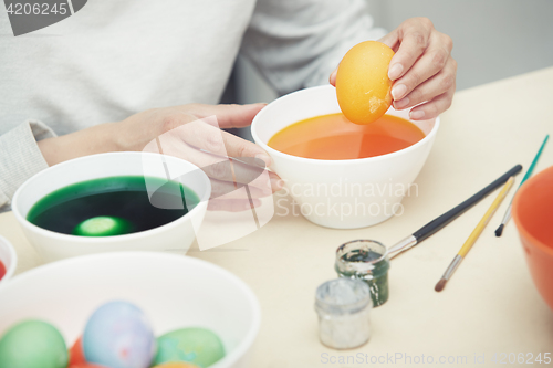 Image of Woman preparing Easter eggs