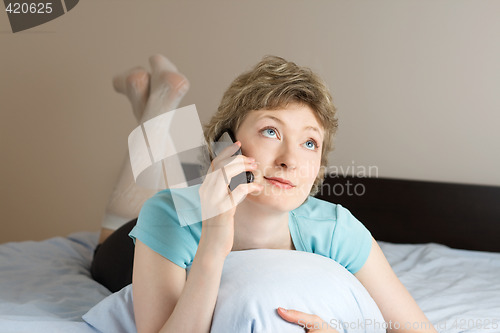 Image of young woman with mobile phone