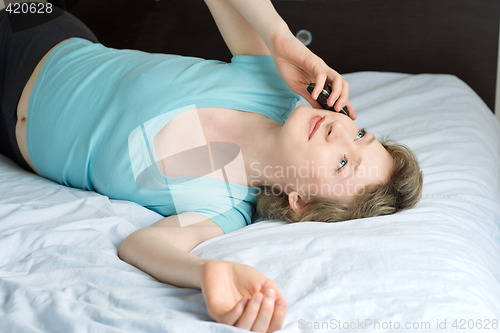 Image of young woman with mobile phone