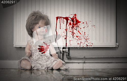 Image of Concept of child abuse - Bloody doll