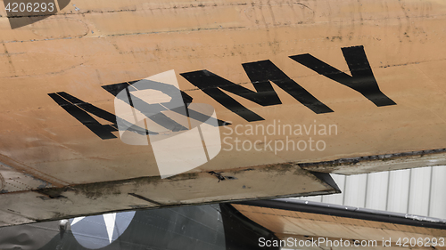 Image of Text on an old war airplane displayed in Saigon