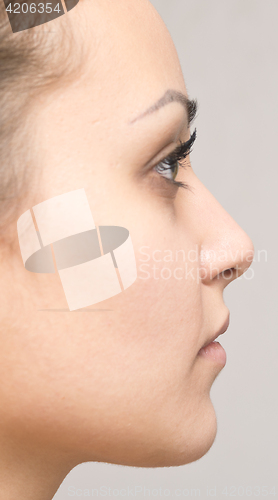 Image of side view of beautiful woman
