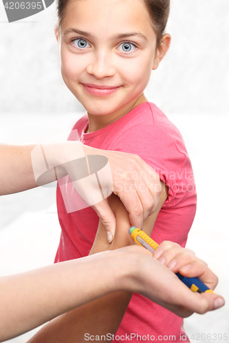 Image of Girl with diabetes during the injections of insulin.