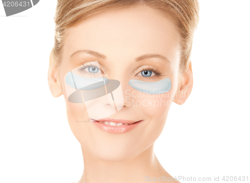 Image of close up of woman face with under-eye patches