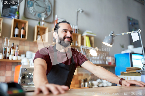 Image of happy man or waiter at bar or coffee shop