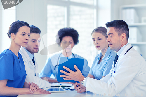 Image of group of happy doctors meeting at hospital office