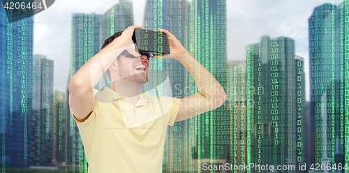 Image of happy man in virtual reality headset or 3d glasses