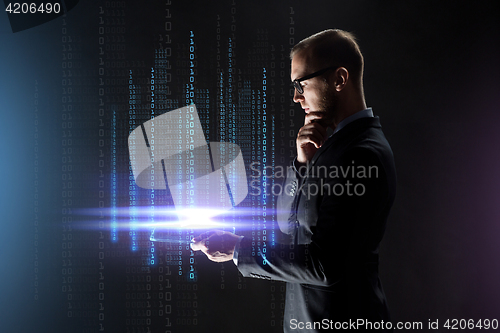 Image of businessman with transparent tablet pc