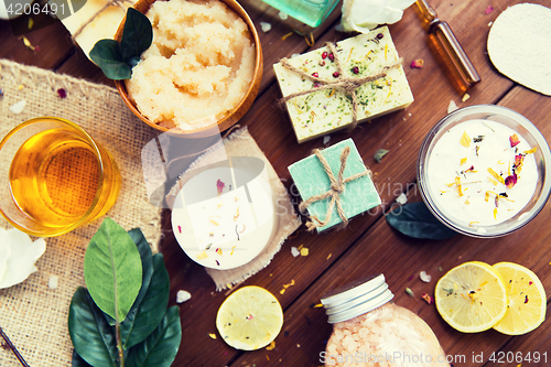 Image of close up of body care cosmetic products on wood