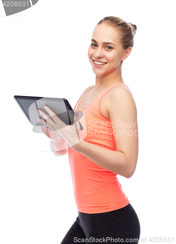 Image of happy smiling sportive young woman with tablet pc