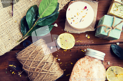 Image of close up of body care cosmetic products on wood