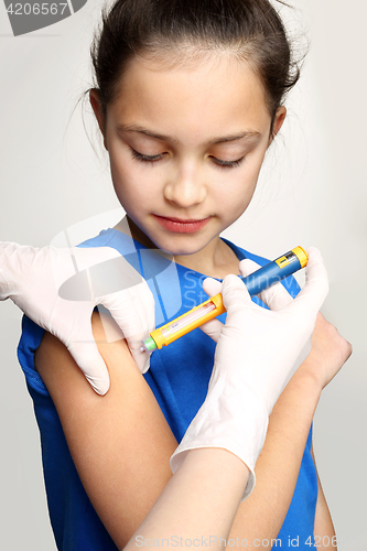 Image of Diabetes in children, child take insulin The injection of insulin, a child with diabetes Doctor diabetologist, injection