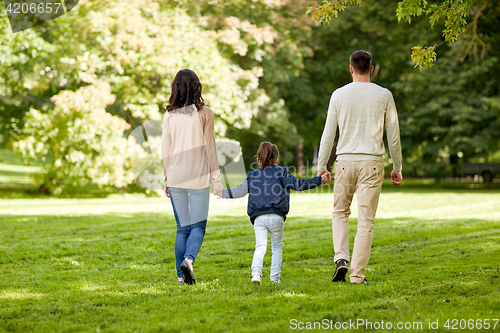 Image of happy family walking in summer park