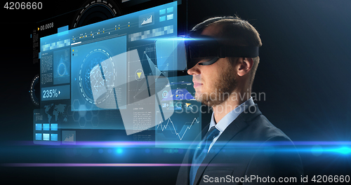 Image of businessman in virtual reality glasses or headset