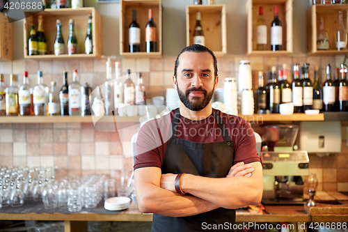 Image of happy man, barman or waiter at bar