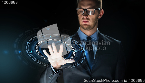 Image of businessman touching virtual screen projection