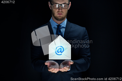 Image of businessman over black background