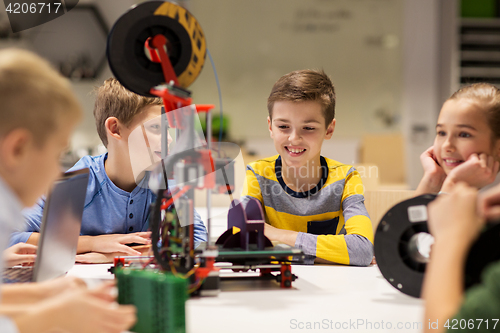 Image of happy children with 3d printer at robotics school